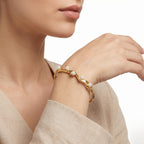 Gold Wavy Pearl Bangle – Sculptural Fashion Jewellery Bracelet